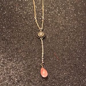 Long gold bead necklace